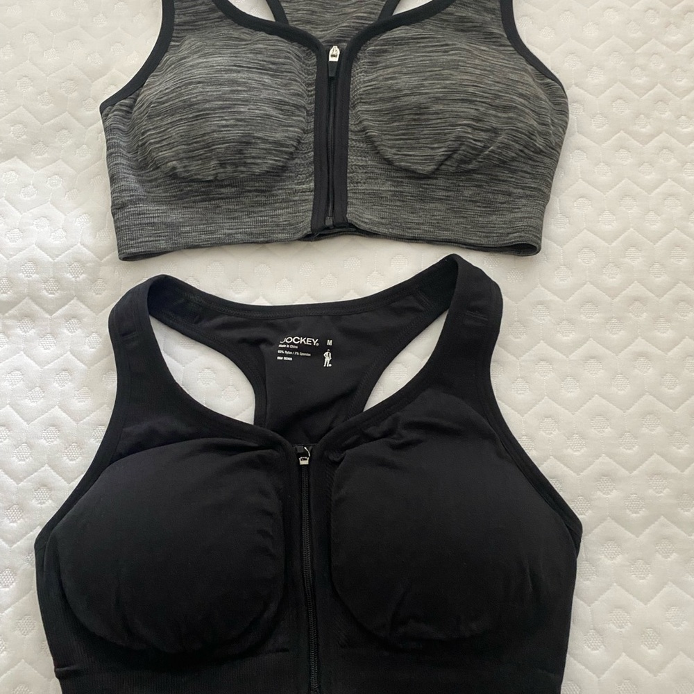 Set of two jockey sports bras padded zip front.
